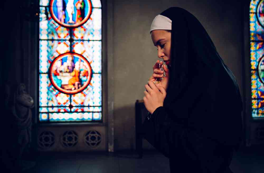 nun praying in a monastery 2021 09 03 20 16 37 utc 1