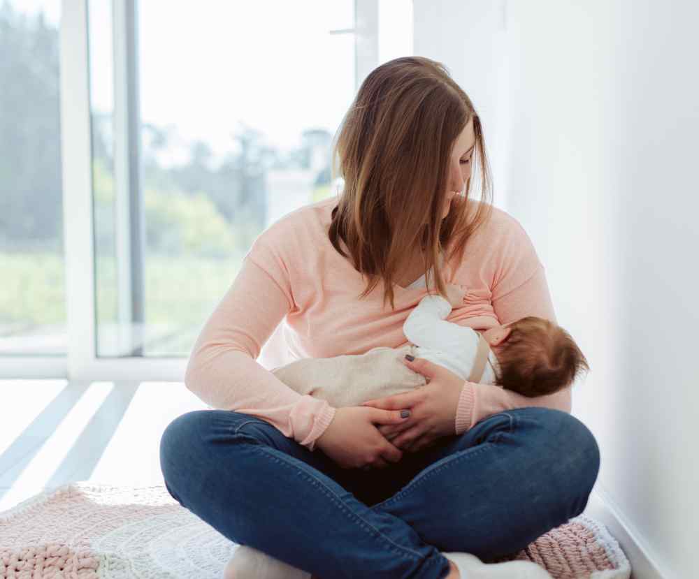 young mother breastfeeding newborn baby 2021 09 02 10 31 15 utc 1