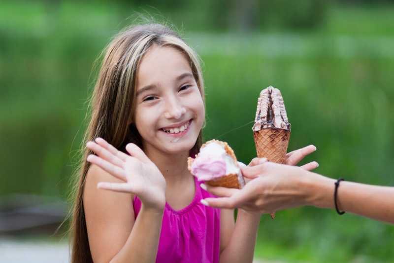 medium shot girl eating ice cream 23 2148268117 1